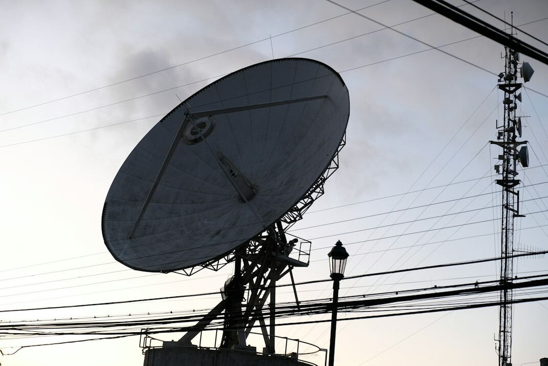 Outside broadcast satellite van with dish raised for live transmission